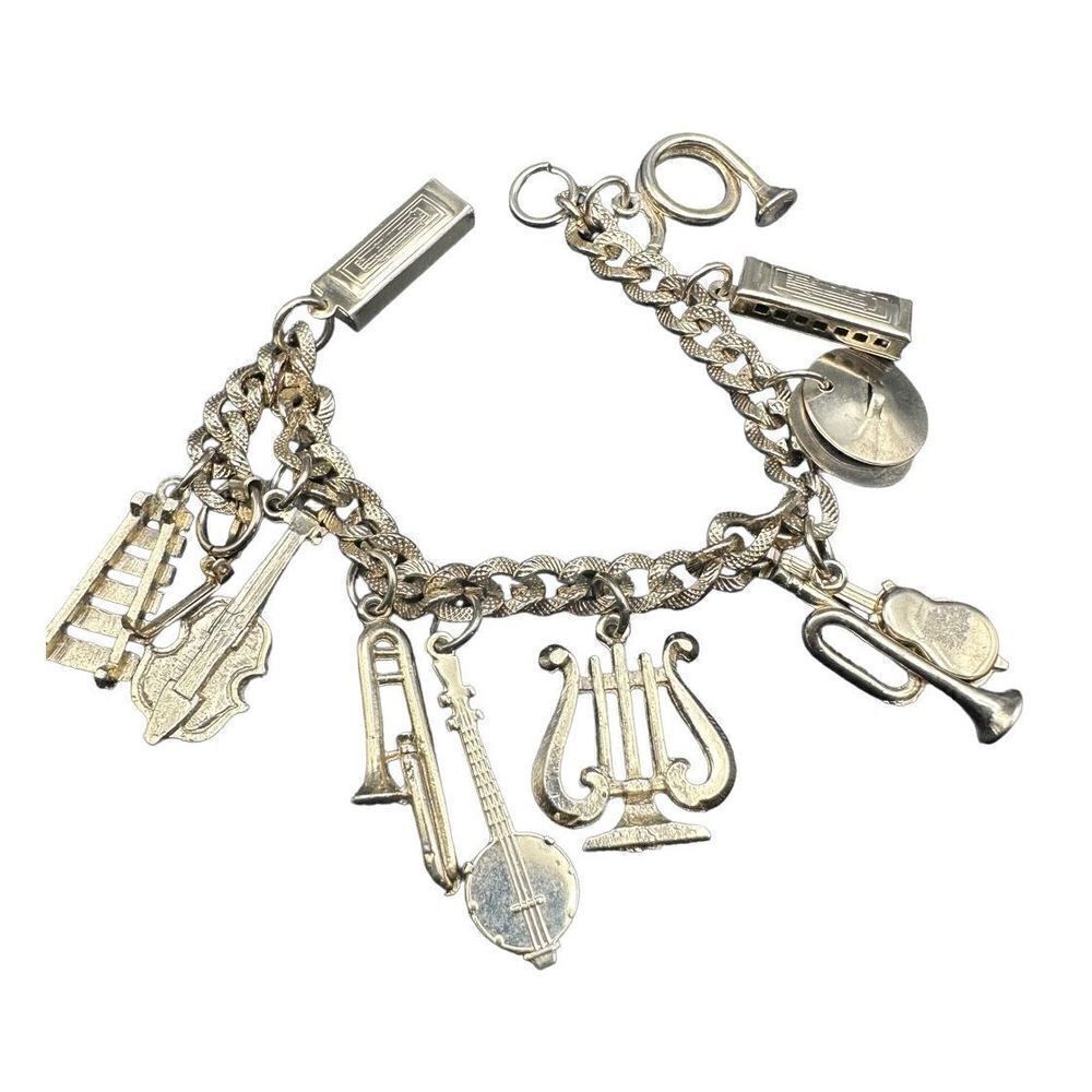 Orchestra charm bracelet vintage gold tone with 11 charms